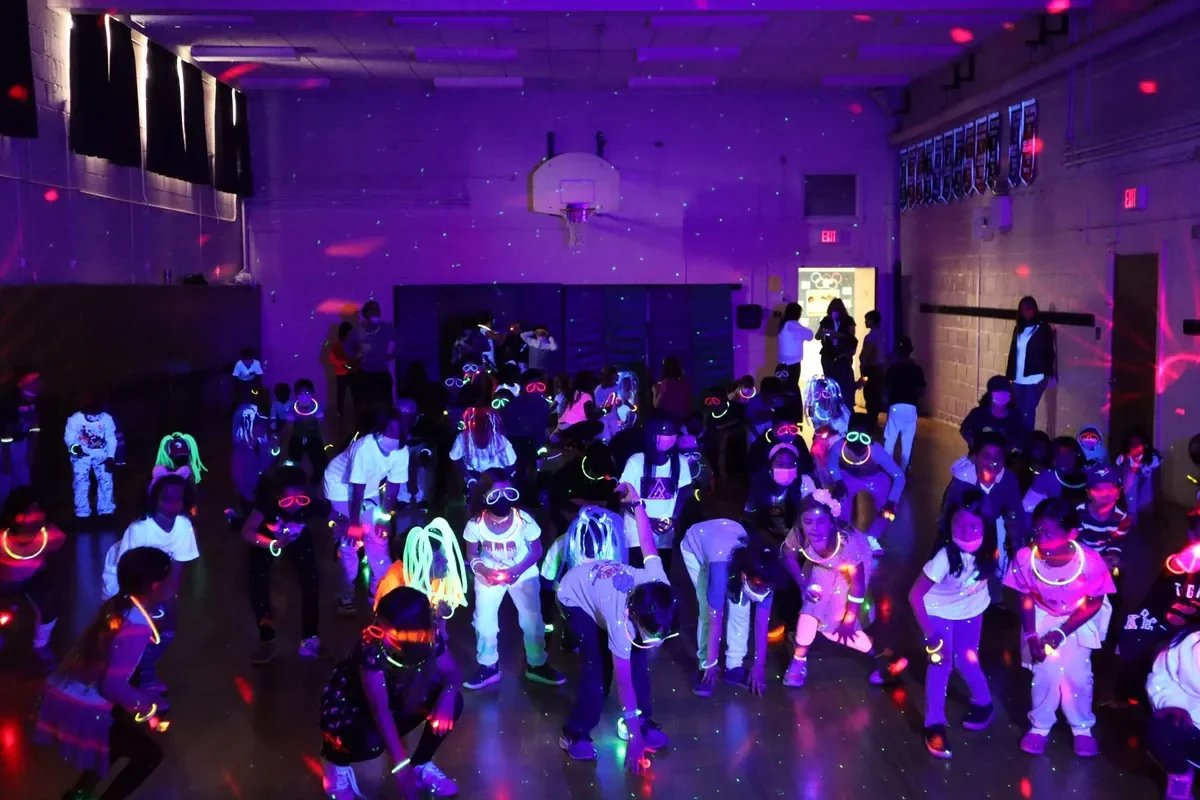 Students enjoying a Presswood glow dance in their school gym